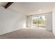 Bright bedroom with sliding glass door to the backyard at 16807 E Gunsight Dr # B23, Fountain Hills, AZ 85268