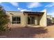 Ground floor patio with sliding glass doors and gravel landscaping at 16807 E Gunsight Dr # B23, Fountain Hills, AZ 85268