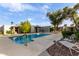 Community pool with lounge chairs and landscaping at 16807 E Gunsight Dr # B23, Fountain Hills, AZ 85268