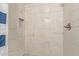 Clean shower with marble-look tile and niche shelving at 16807 E Gunsight Dr # B23, Fountain Hills, AZ 85268