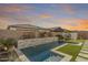 Luxury backyard pool with a stone water feature at 17155 W Gracemont St, Surprise, AZ 85388