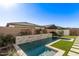 Luxury backyard pool with a stone water feature at 17155 W Gracemont St, Surprise, AZ 85388