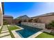 Luxury backyard pool with a stone water feature at 17155 W Gracemont St, Surprise, AZ 85388