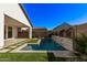 Luxury backyard pool with a stone water feature at 17155 W Gracemont St, Surprise, AZ 85388