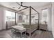 Main bedroom with canopy bed, dresser, and ceiling fan at 17155 W Gracemont St, Surprise, AZ 85388