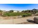 Green lawn and community area with houses in the background at 17155 W Gracemont St, Surprise, AZ 85388