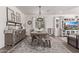 Farmhouse-style dining room with rustic table and chandelier at 17155 W Gracemont St, Surprise, AZ 85388