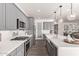 Gray cabinets, white countertops, and stainless steel appliances in this modern kitchen at 17155 W Gracemont St, Surprise, AZ 85388