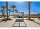 Daybed and lounge chairs around resort-style pool at 17155 W Gracemont St, Surprise, AZ 85388