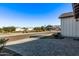 Quiet street view of a suburban neighborhood with manicured lawns at 17155 W Gracemont St, Surprise, AZ 85388