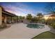 Outdoor oasis featuring a pool, covered patio, and beautiful sunset views at 17708 N 92Nd St, Scottsdale, AZ 85255