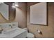 Chic powder room with an elegant sink and modern fixtures at 17708 N 92Nd St, Scottsdale, AZ 85255