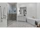 Elegant Primary bath with a large walk-in shower and soaking tub at 17708 N 92Nd St, Scottsdale, AZ 85255