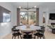 Modern dining area with patio access and stylish light fixture at 17708 N 92Nd St, Scottsdale, AZ 85255