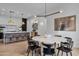 Elegant dining room with a large round table and modern light fixture at 17708 N 92Nd St, Scottsdale, AZ 85255