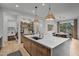 Modern kitchen with a large island and built-in bar area at 17708 N 92Nd St, Scottsdale, AZ 85255