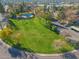 Aerial view of community featuring a grassy area, pool, and apartment buildings at 18815 N 34Th Ave # 4, Phoenix, AZ 85027