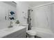 Updated bathroom with a bathtub, shower, and marble-look walls at 18815 N 34Th Ave # 4, Phoenix, AZ 85027