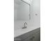 Modern bathroom with gray vanity, a large mirror, and updated fixtures at 18815 N 34Th Ave # 4, Phoenix, AZ 85027