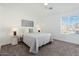 Spacious bedroom with a comfortable bed, neutral decor and ample natural light at 18815 N 34Th Ave # 4, Phoenix, AZ 85027