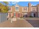 Two-story townhome with red door and landscaping at 18815 N 34Th Ave # 4, Phoenix, AZ 85027