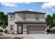 Two-story house with neutral colors, attached garage, and landscaping at 20090 W Badgett Ln, Litchfield Park, AZ 85340