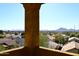 Elevated view of neighborhood, showcasing homes and distant mountains at 2105 E Kerry Ln, Phoenix, AZ 85024