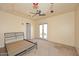 Spacious bedroom with ceiling fan and French doors at 2105 E Kerry Ln, Phoenix, AZ 85024