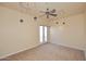 Bright bedroom with ceiling fan and access to balcony at 2105 E Kerry Ln, Phoenix, AZ 85024