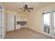 Bright bedroom with built-in desk and double doors leading to balcony at 2105 E Kerry Ln, Phoenix, AZ 85024