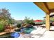 Inviting pool with waterfall feature and spacious deck at 2105 E Kerry Ln, Phoenix, AZ 85024