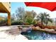 Relaxing pool and spa with waterfall and lush landscaping at 2105 E Kerry Ln, Phoenix, AZ 85024