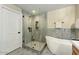 Bathroom with a large walk-in shower and a free-standing bathtub at 21320 N 56Th St # 1133, Phoenix, AZ 85054