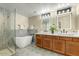 Elegant bathroom with a double vanity, soaking tub, and a separate shower at 21320 N 56Th St # 1133, Phoenix, AZ 85054