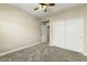 Bright bedroom with ceiling fan and double doors to closet at 21320 N 56Th St # 1133, Phoenix, AZ 85054