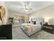 Main bedroom with plush bed and ceiling fan at 21320 N 56Th St # 1133, Phoenix, AZ 85054