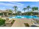 Community pool with plenty of lounge chairs and a relaxing atmosphere at 21320 N 56Th St # 1133, Phoenix, AZ 85054