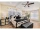 Bright bedroom with a metal-framed bed and neutral color scheme at 22183 N 178Th Ave, Surprise, AZ 85387