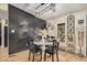 Dining area with a round white table and black chairs at 22183 N 178Th Ave, Surprise, AZ 85387