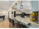 Kitchen with a breakfast bar, stainless steel appliances, and marble countertops at 22183 N 178Th Ave, Surprise, AZ 85387