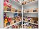 Well-organized pantry with various food items in labeled baskets at 22183 N 178Th Ave, Surprise, AZ 85387