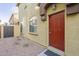 Townhome entrance with red door and desert landscaping at 2250 E Deer Valley Rd # 48, Phoenix, AZ 85024