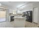 Modern kitchen island with granite countertops and white cabinets at 2250 E Deer Valley Rd # 48, Phoenix, AZ 85024