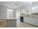 Kitchen features granite countertops, white cabinets, and a breakfast bar at 2250 E Deer Valley Rd # 48, Phoenix, AZ 85024