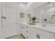 Double vanity bathroom with white cabinets and a shower at 23120 E Twilight Dr, Queen Creek, AZ 85142