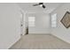 Bright bedroom with carpet flooring and ceiling fan at 23120 E Twilight Dr, Queen Creek, AZ 85142