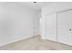 Well-lit bedroom with carpet and sliding doors at 23120 E Twilight Dr, Queen Creek, AZ 85142