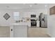 Bright kitchen featuring white shaker cabinets and stainless steel appliances at 23120 E Twilight Dr, Queen Creek, AZ 85142