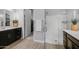 Modern bathroom with double vanity, glass shower, and dark wood cabinets at 2653 E Marcos Dr, Casa Grande, AZ 85194