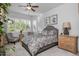 Spacious bedroom with a ceiling fan and large windows at 2653 E Marcos Dr, Casa Grande, AZ 85194